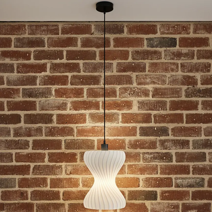 Hourglass Pendant Light, against a brick wall